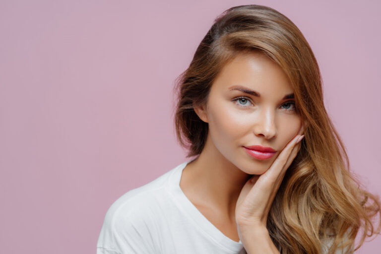 close-up-shot-self-confident-beautiful-caucasian-woman-has-long-hair-combed-one-side